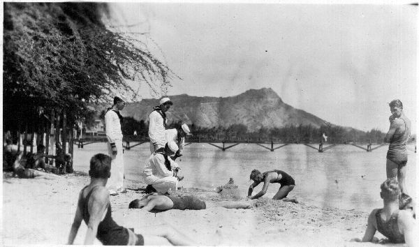 Sailors sitting on the beach during fleet week