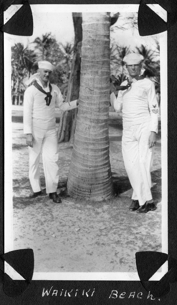 Sailors posing for a picture next to a street during fleet week on Waikiki Beach