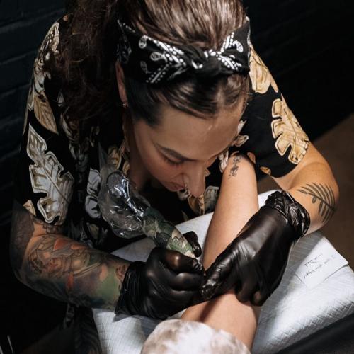 Free Photos - A Female Tattoo Artist With Red Hair, Wearing A Black Shirt,  Standing In A Tattoo Parlor. She Is An Attractive And Creative Professional  Who Is Passionate About Her Work. |